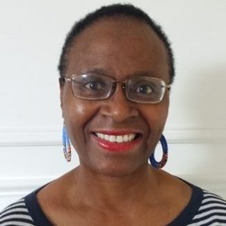 Photo of Sylvia Watts-Cherry, smiling directly to the camera.